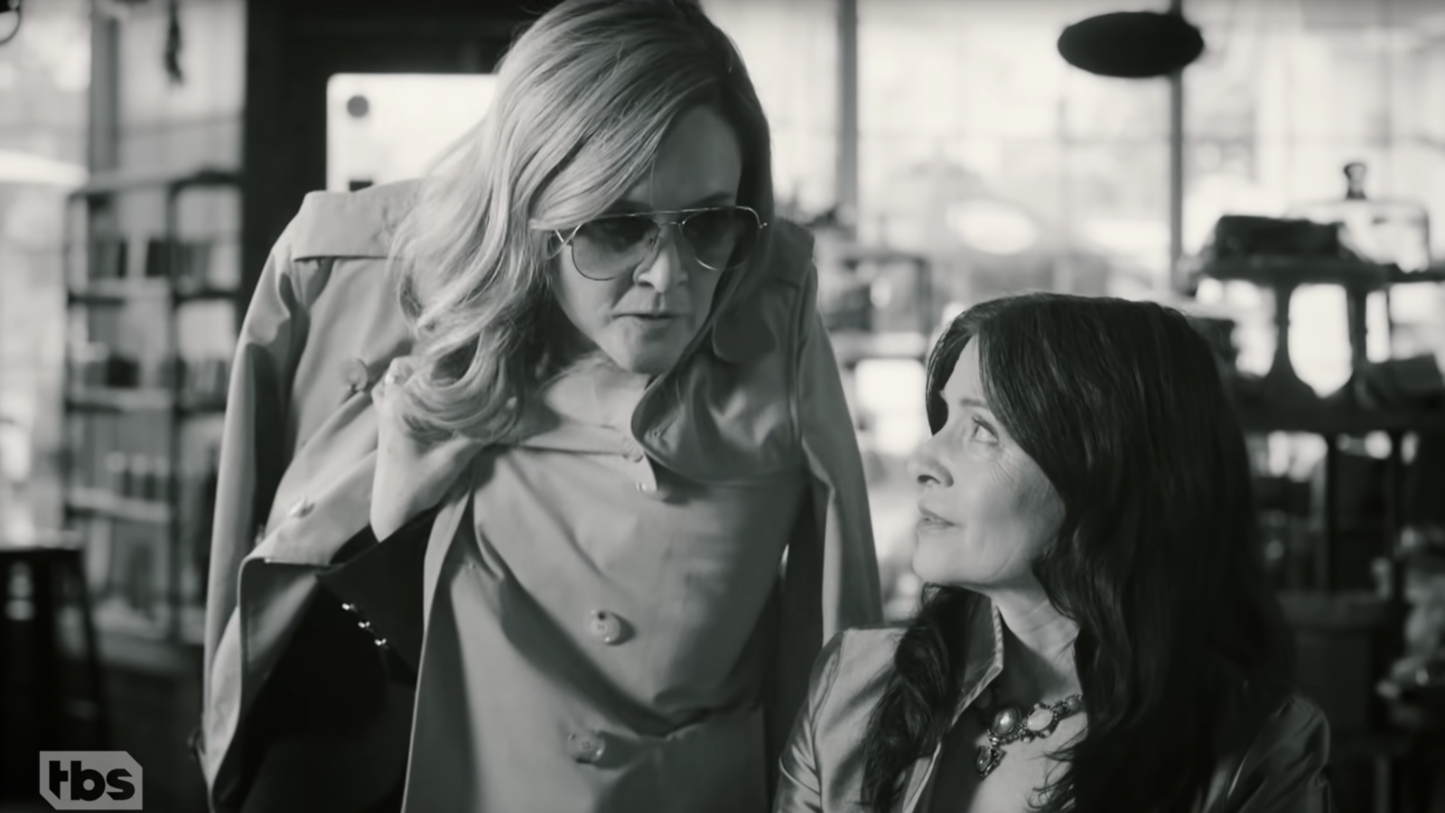 Black and white image of Samantha Bee and Rebecca Wright in a cafe